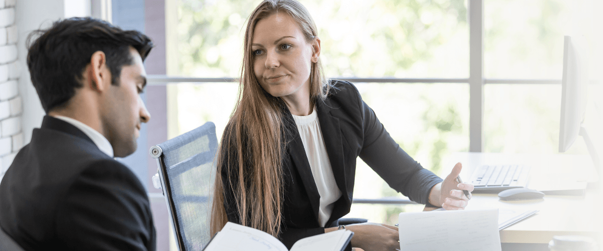 Woman and man in office looking displeased, image to illustrate loss of transfer fees